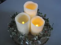 Flickering Candle and Holly display